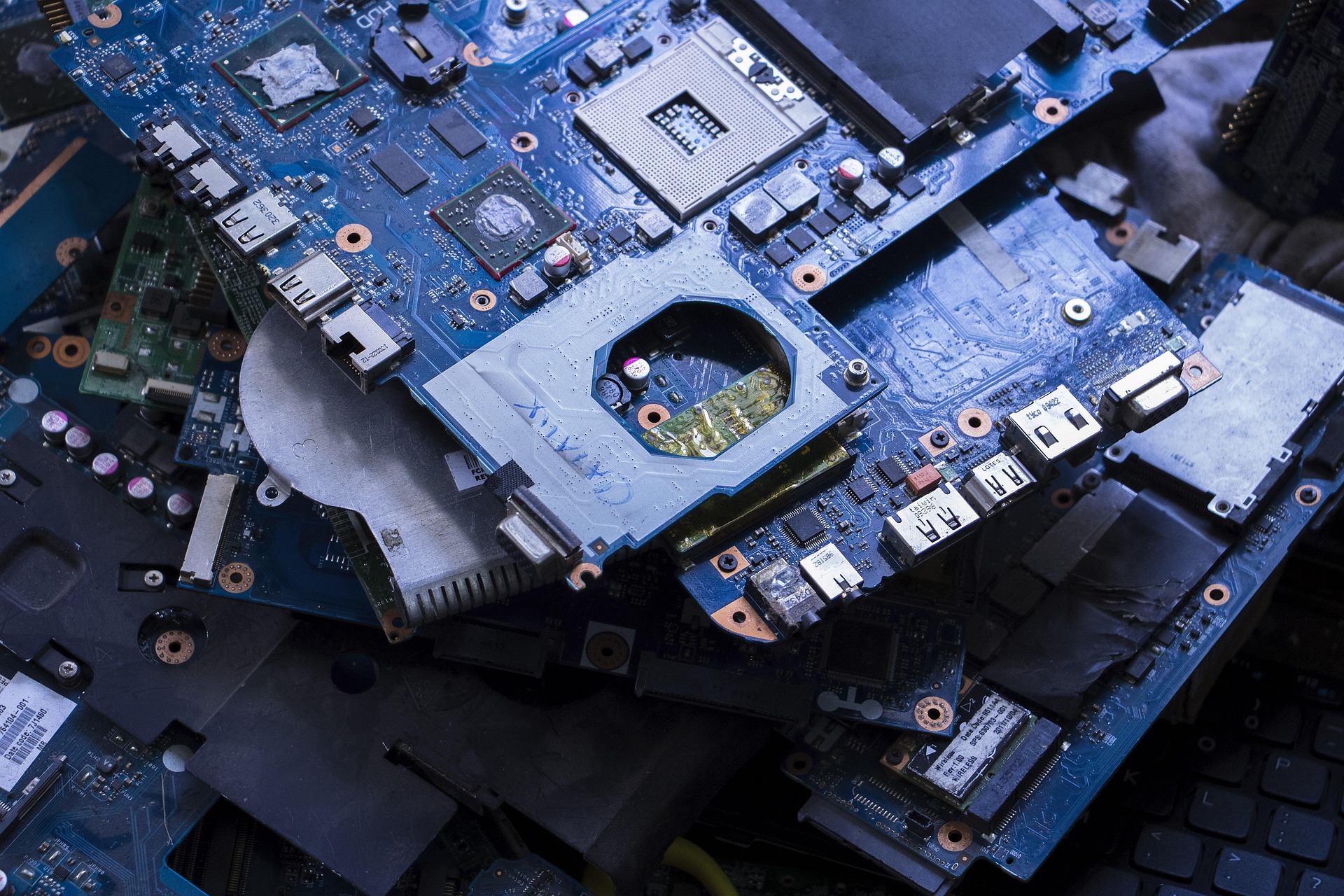 IT asset disposal: used laptop motherboards collected for secure recycling