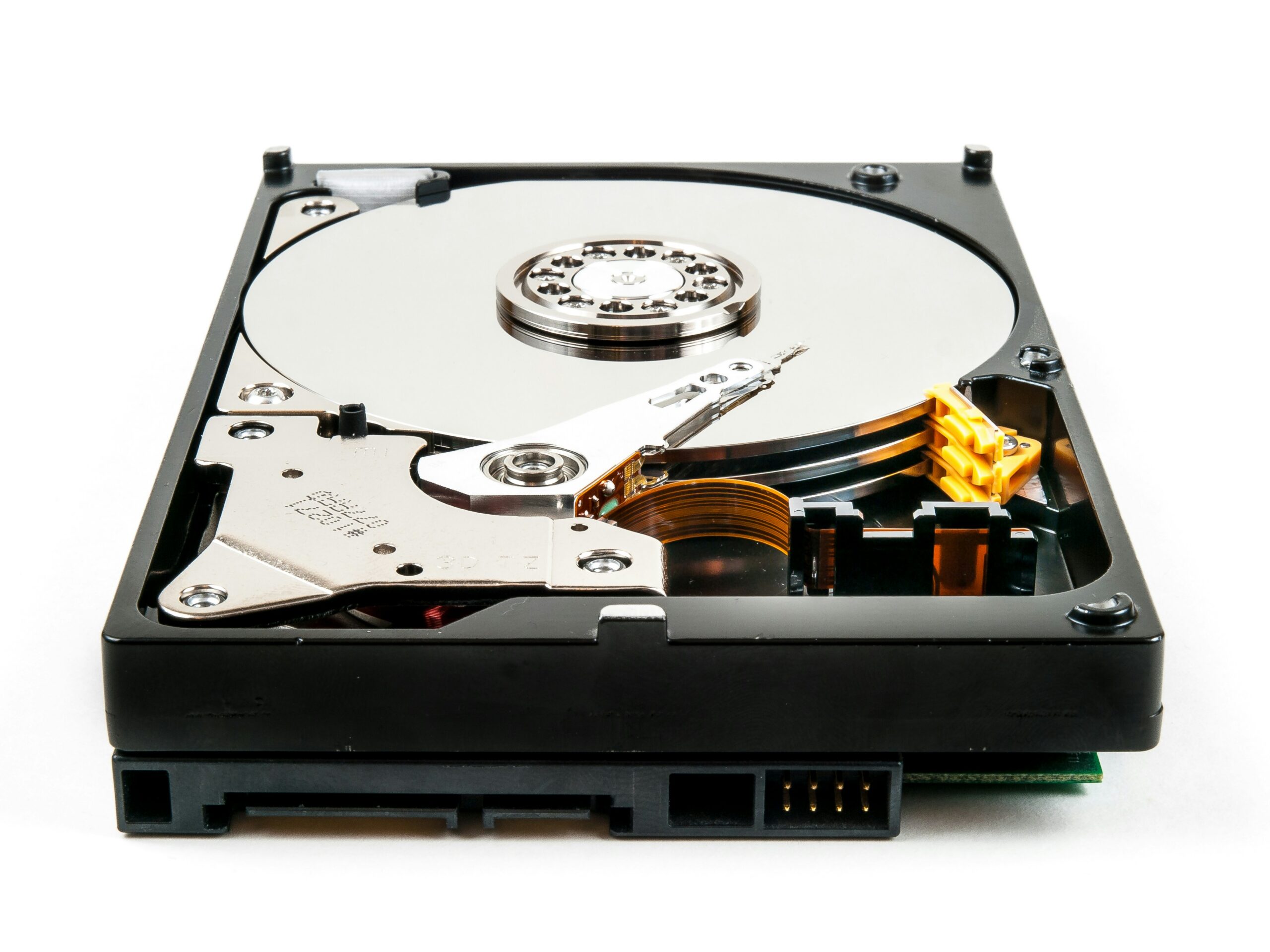 Secure data destruction: an opened hard disk drive showing its platter
